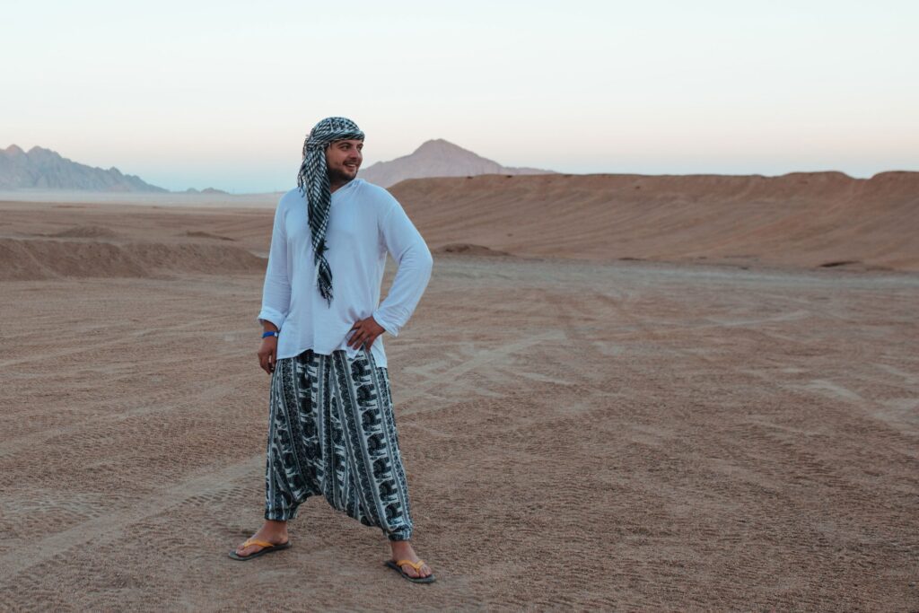 man in arafat and bedouin clothes in the desert on