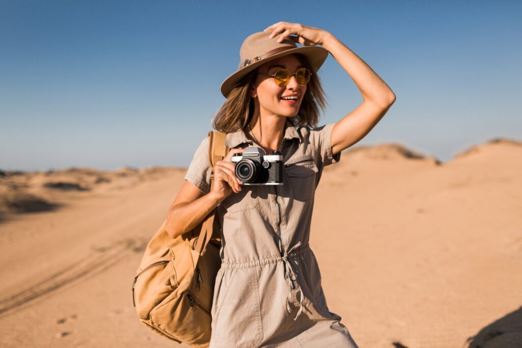 woman in desert walking on safari